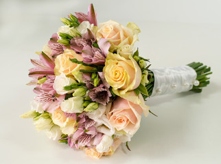 Bridal bouquet of roses and alstroemeria isolated on white