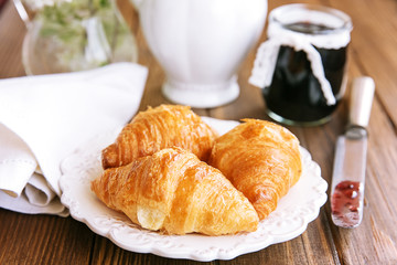Breakfast with fresh croissants and jam