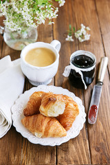 Fresh baked croissants, coffee and jam