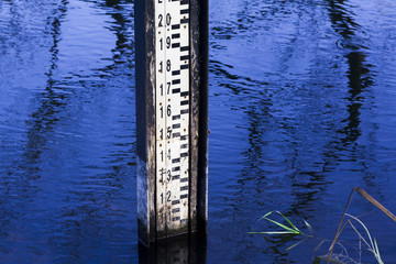 Water level measurement gauge during flood.