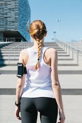 Fototapeta na wymiar Jogging. Portrait of a woman takes a break from running