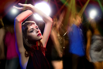 Drug or Alcohol intoxicated female dancing at a nightclub