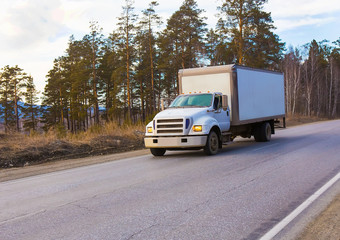 Fototapeta na wymiar Truck driving on country road