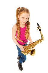 Tope view of smiling girl holding alto saxophone