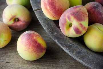group of fresh peaches on wood background