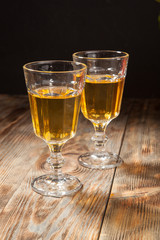 glass of white wine on a wooden table
