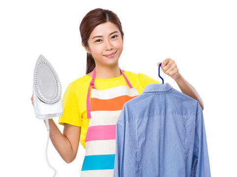 Housewife use steam iron and suit jacket