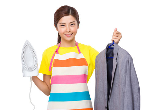 Asian Housewife use steam iron and suit jacket