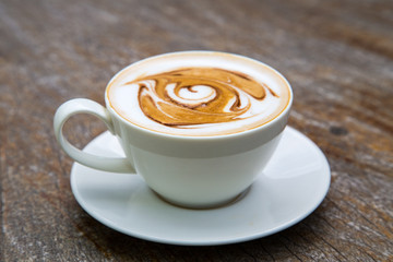 art latte coffee on white cup