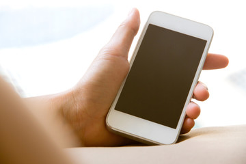 Woman hand holding a Smart Phone