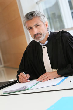 Mature lawyer working on judgement report