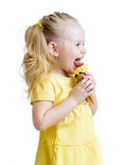 Naklejka premium child eating ice cream in studio isolated