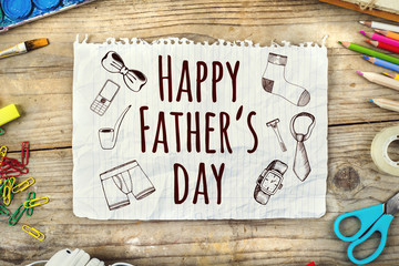 Artists desk with Happy fathers day sign on wooden background.