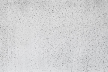 White concrete wall with relief plaster pattern