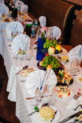catering table set service with silverware and glass stemware at
