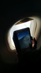 Aeroplane wing through tab camera and window