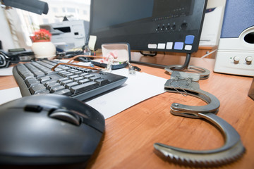 Handcuffs open paper clip on the table office worker