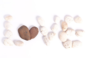 The word Love with stone on white background