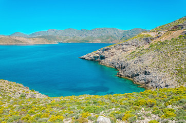 Peaceful azure sea bay with clear water on Greek island, Greece