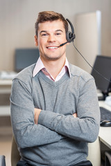 Confident Customer Service Representative Sitting In Office