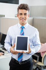 Manager Holding Tablet Computer At Call Center