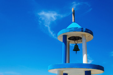 Typical blue-white church tower (steeple) with bell, Greece