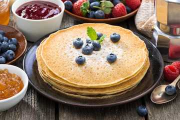 crepes, fresh berries and jams, close-up