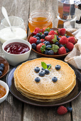crepes, fresh berries and jams, vertical
