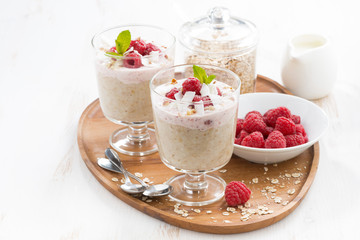 healthy dessert with oatmeal, whipped cream and raspberries 