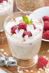 healthy dessert with oatmeal, whipped cream and raspberries 