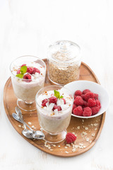 healthy dessert with oatmeal, whipped cream and raspberries 