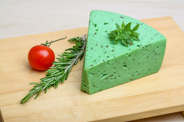 Green pesto cheese and basil leaves