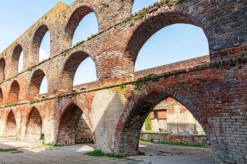 Fototapeta na wymiar arches in a ruin of a monastery building of red brick, Northern