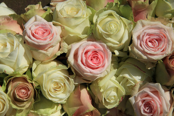 White and Pink roses in wedding arrangement