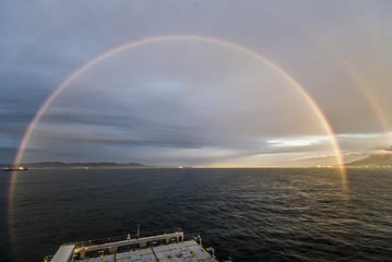 Fototapeta na wymiar Double Rainbow at sea