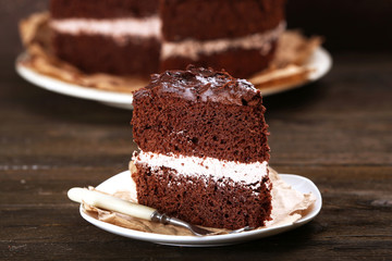 Delicious chocolate cake on table close-up