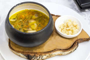 soup with beans and mushrooms garnished with goat cheese