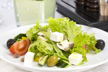 Greek salad on a table in a restaurant