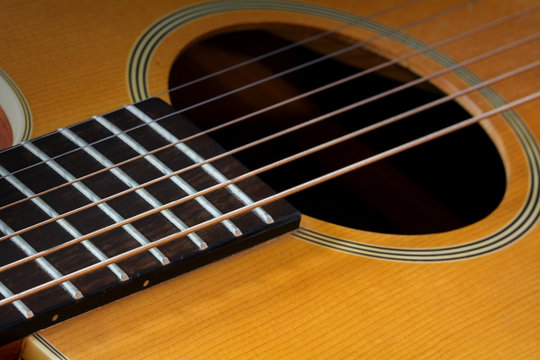 guitar fretboard and sound hole, detail