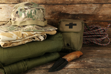 Hiking gear on wooden background