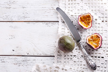 Passion fruits on color wooden background