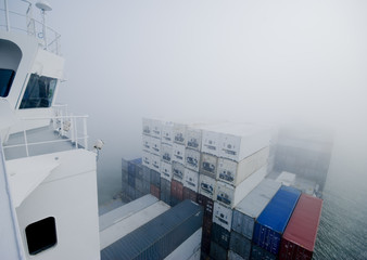 cargo ship navigating through misty English Channel