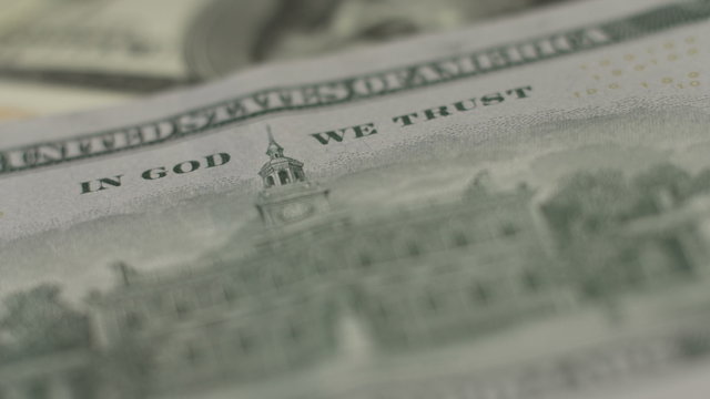 In God we trust motto on one hundred-dollar bill, closeup