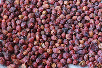 Dried rose hips on a linen background