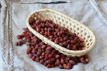 Dried rose hips on a linen background
