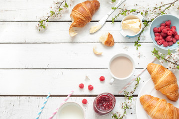 Romantic french or rural breakfast with croissants on white. - obrazy, fototapety, plakaty