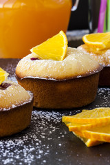 Muffins with berries and oranges