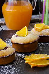 Muffins with berries and oranges