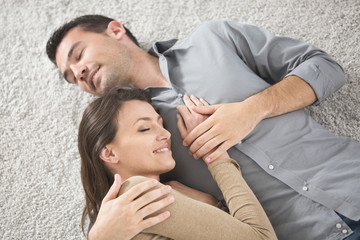 happy young couple lying down