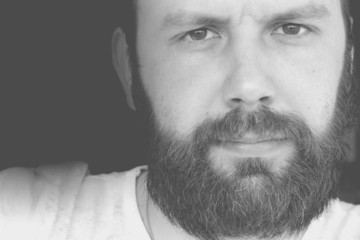 Obraz premium portrait of a bearded man smile leisure talking on the phone